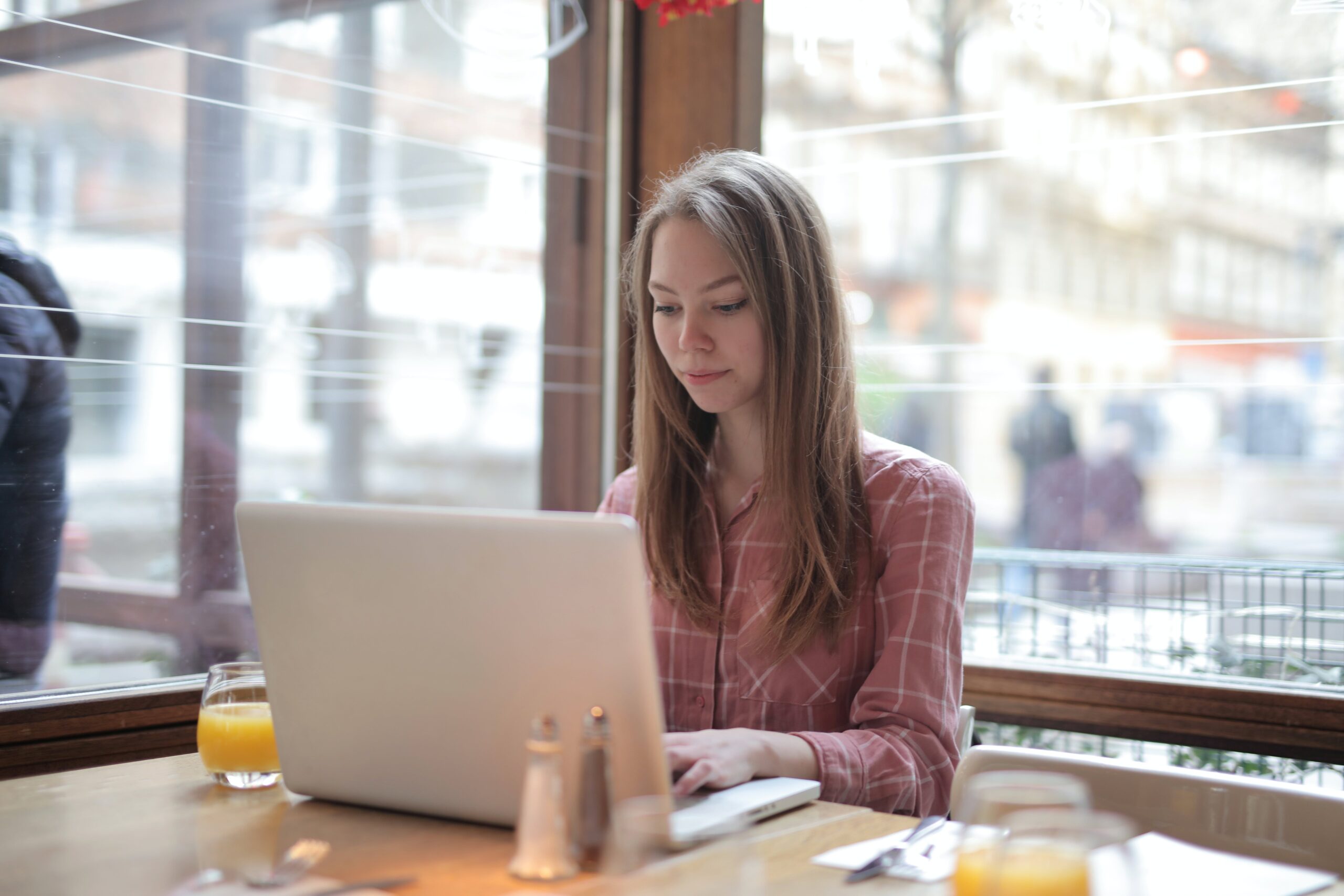 A professional working on laptop for debt settlement